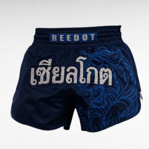 Muay Thai Shorts Supplier featuring close-up of navy shorts with REEDOT logo and Thai embroidery