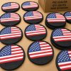 Custom USA flag PVC coasters with debossed Reedot Sports branding in bulk production.